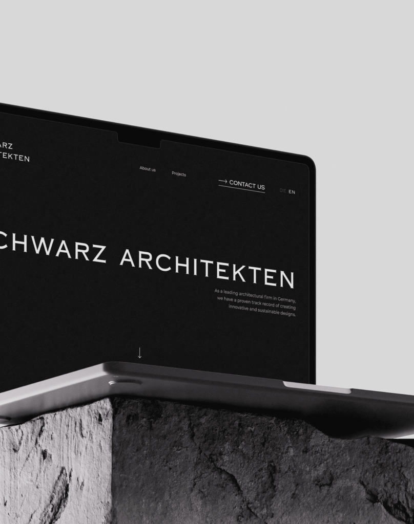 Laptop mit Website der Firma Schwarz Architekten, Menü auf Deutsch und Englisch verfügbar